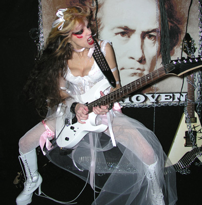 WENN - THE CELEBRITY WORLD ENTERTAINMENT NEWS NETWORK - FEATURES THE GREAT KAT: "YOUTUBE SENSATION THE GREAT KAT HAS BECOME KNOWN FOR HER HEAVY METAL TAKE ON CLASSICAL MUSIC"! "The Great Kat shows off unique talents on Beethoven Shreds. YouTube sensation The Great Kat has become known for her heavy metal take on classical music and her shredding skills on the guitar have captivated audiences across the world. She has now recorded her unique talents on disc for Beethoven Shreds, showing listeners exactly why she is the world's fastest guitar shredder." - Wenn