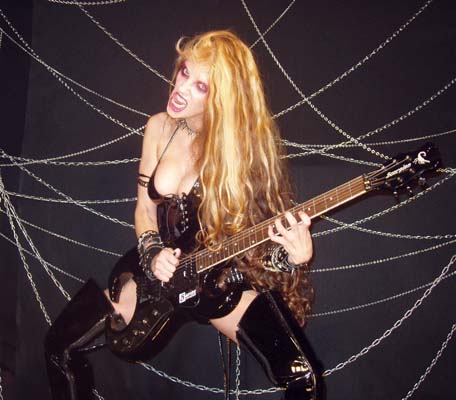 MELODICGUITAR.COM FEATURES THE GREAT KAT IN "GUITAR HERO, PART 2"! "The Great Kat is the stage name of Katherine Thomas, who is famous for Classical music interpretations in thrash metal music. Mostly she played with electric guitars, but sometimes she plays the violin. In fact Thomas was the coach of the violin, graduated from the Juilliard School and had a tour playing conventional classical music before finally crossing into metal." 