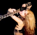 VIRTUOSOS DE LA GUITARRA NAMES THE GREAT KAT "MOST PROMINENT WOMEN ROCK GUITARISTS"! "The Great Kat. Her real name is Katherine Thomas and is known to have a very special talent for stringed instruments like the violin and guitar." -Virtuosos De La Guitarra