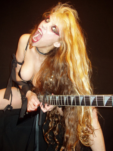 THE OTHER VIEW'S REVIEW OF "BEETHOVEN'S GUITAR SHRED" DVD! "The Great Kat hardcore metal musician with some serious shred, Im talkin bloody fingers fast dudes. She takes classic tunes and mixes it up with some metal and produces one unique, fast-paced sound. Theres nothing like seeing a woman spread wide with a guitar between her legs. If youre a fan of heavy metal then definitely take The Great Kats Beethovens Guitar Shred for a spin; its a unique spin on classic hits thats sure to please. Its been Valkor tested and TOV Approved." - By Valkor, The Other View