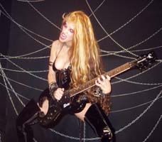 GUITAR WORLD MAGAZINE NAMES THE GREAT KAT "50 FASTEST GUITARISTS OF ALL TIME"! "The Great Kat. SIGNATURE SONG: 'The Flight of the Bumble Bee'. Juilliard-trained virtuoso. Heavy leather dominatrix persona so over the top." - Guitar World Magazine